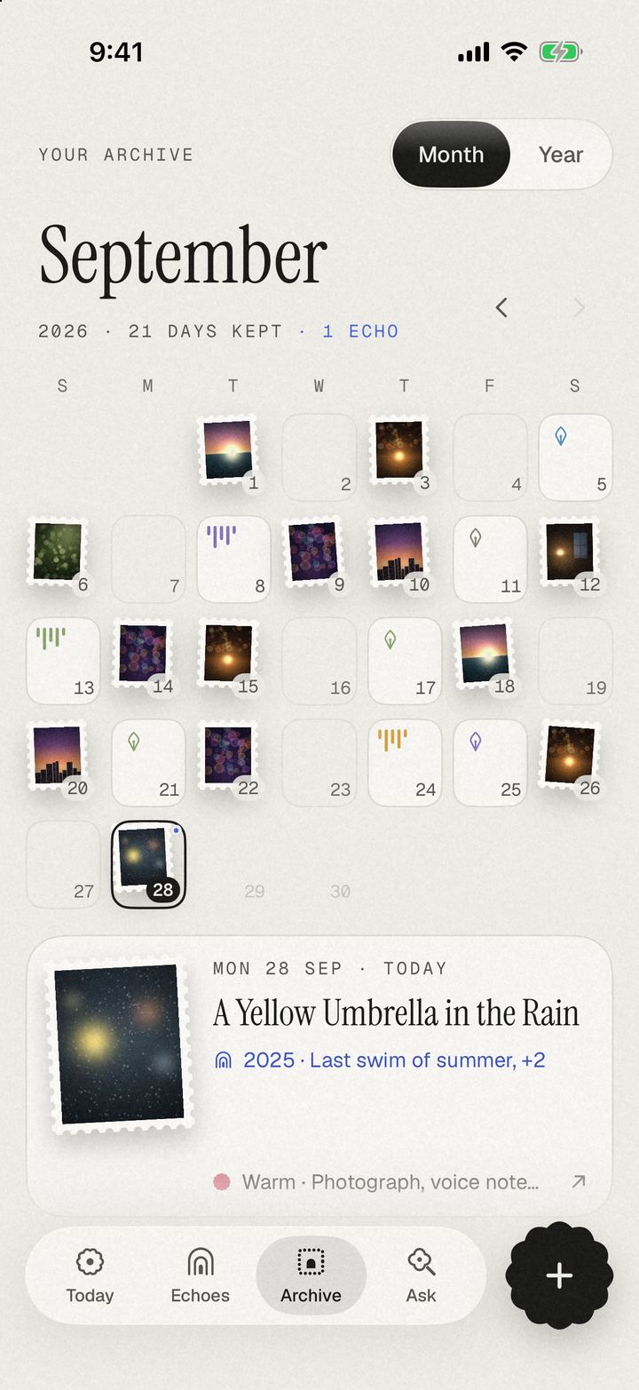 The Archive in Month view: September 2026 as a calendar of postage stamps, photos and small voice and ink tiles, with the 28th selected: “A Yellow Umbrella in the Rain”.